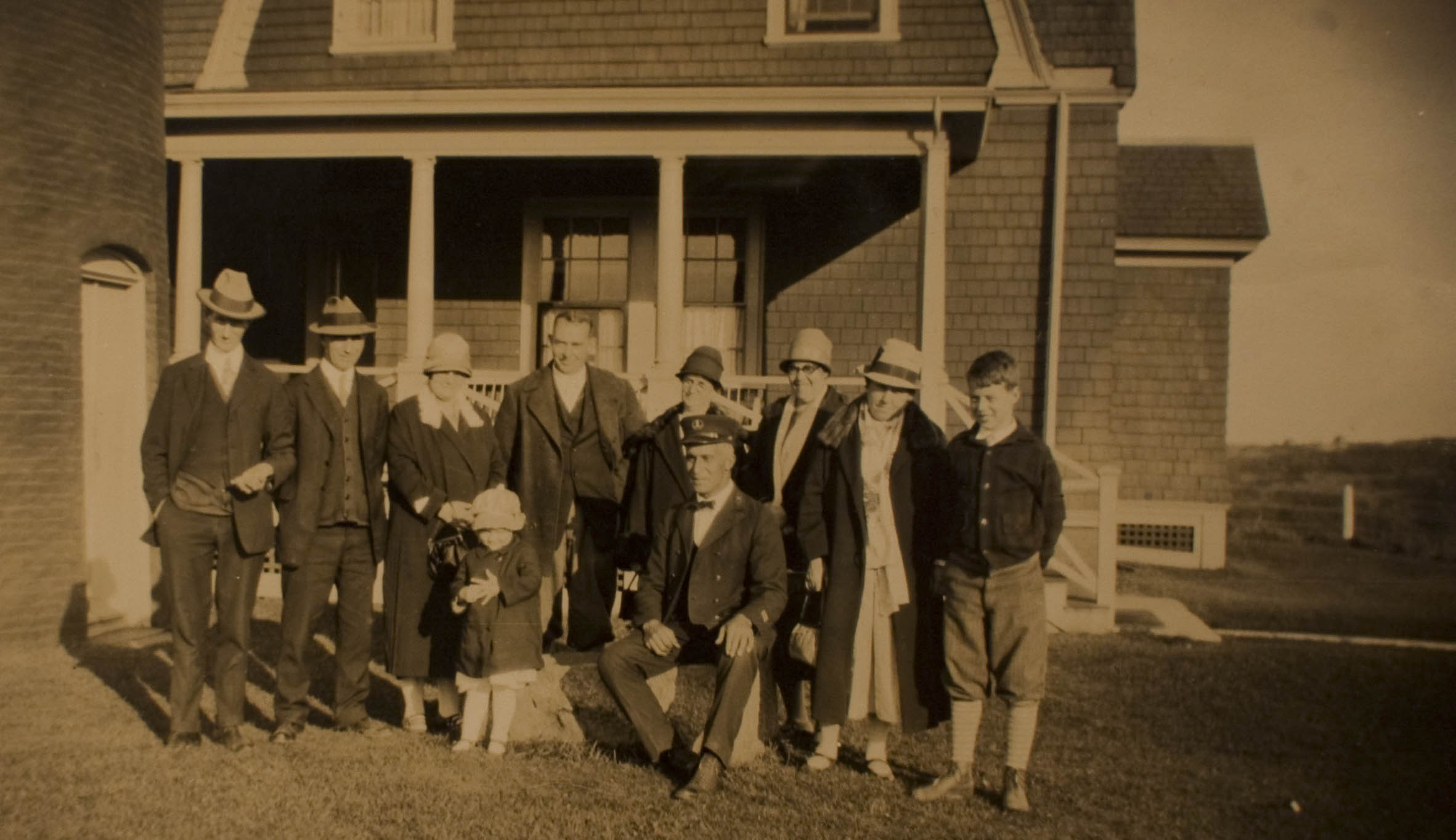 Locally famous lighthouse keeper Charles W. Vanderhoop, of the Aquinnah Wampanoag community, who oversaw lighthouses on Nantucket and Martha’s Vineyard. Vanderhoop is seated in front of a few of the thousands of tourists who visited Gay Head Light every year. (Courtesy of Ms. Martha Lee)