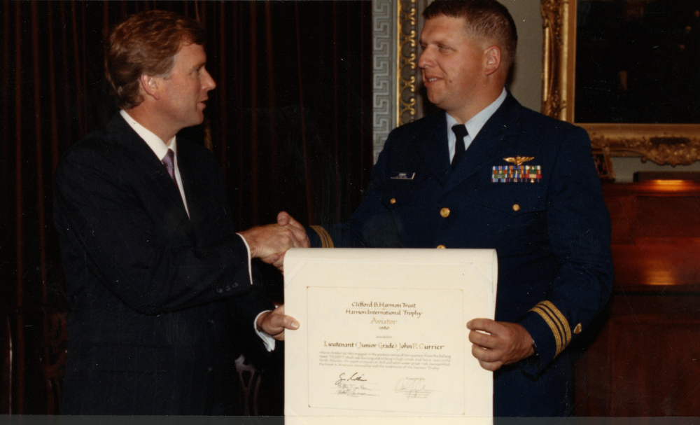 The Harmon Trophy was presented to John Currier at the Old Executive Building across from the White House by Vice President Dan Quayle on June 21, 1991 (11 years after the mission). His name is inscribed on the six-foot trophy encased in a glass enclosure in the National Air and Space Museum. Interestingly, Currier was never notified regarding his selection for the award, which has historically been presented by the President. (U.S. Coast Guard) The Harmon Trophy was presented to John Currier at the Old Executive Building across from the White House by Vice President Dan Quayle on June 21, 1991 (11 years after the mission). His name is inscribed on the six-foot trophy encased in a glass enclosure in the National Air and Space Museum. Interestingly, Currier was never notified regarding his selection for the award, which has historically been presented by the President. (U.S. Coast Guard)