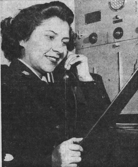 Newspaper photo showing Yeoman Corrine Goslin at the Coast Guard’s Captain of the Port located in Tampa, Florida. (Tampa Tribune)