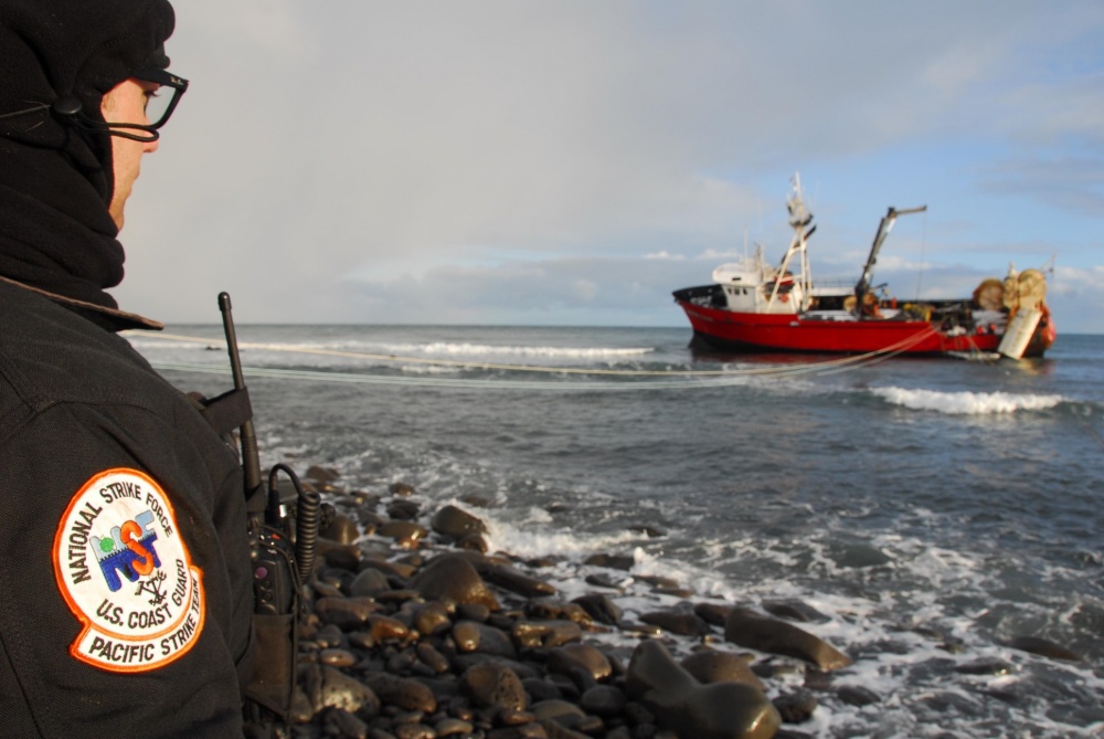 6. Pacific Strike Team member, Chief Petty Officer Alan Dooley, observes fuel-lightering operations on a grounded fishing vessel on St. George Island, Alaska. (Coast Guard Photo-PA3 Walter Shinn) 6. Pacific Strike Team member, Chief Petty Officer Alan Dooley, observes fuel-lightering operations on a grounded fishing vessel on St. George Island, Alaska. (Coast Guard Photo-PA3 Walter Shinn)