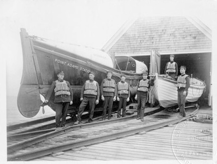 Crew standing outside of Point Adams Life-Saving Station